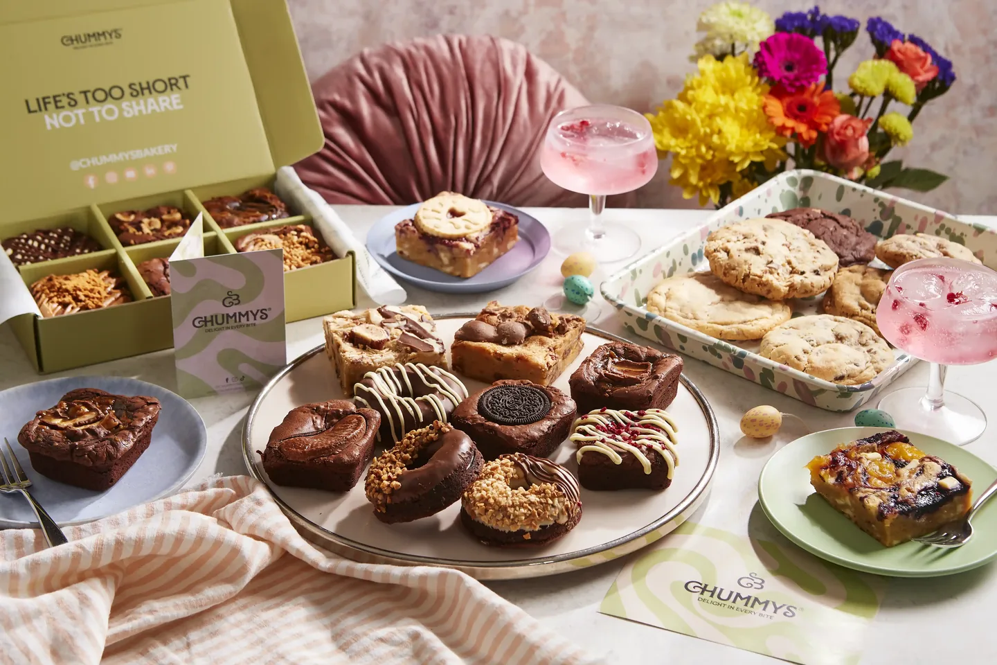 A styled spread of Chummy's brownies and treats